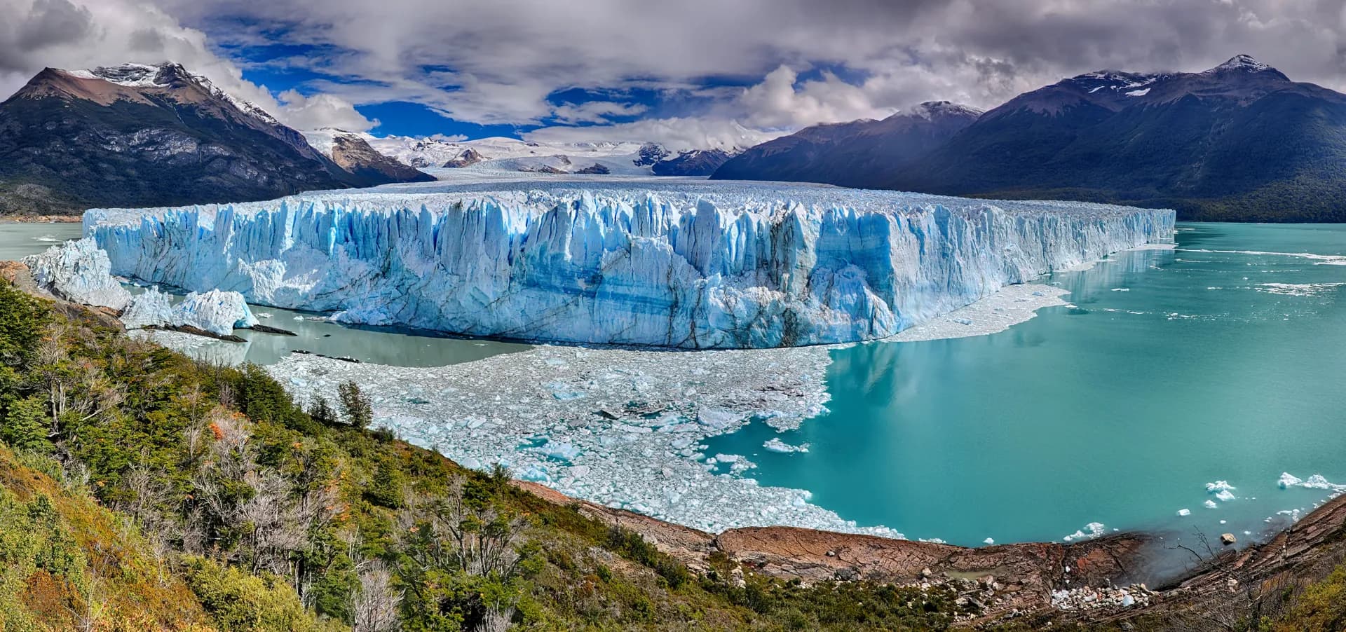 Perito Moreno Glacier panorama with turquoise glacial lake and Andes mountains