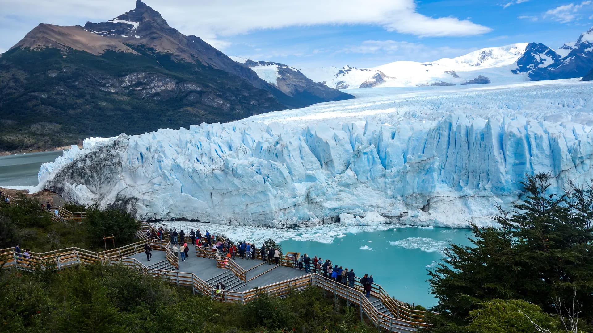 Perito Moreno Glacier blue ice wall calving into glacial waters